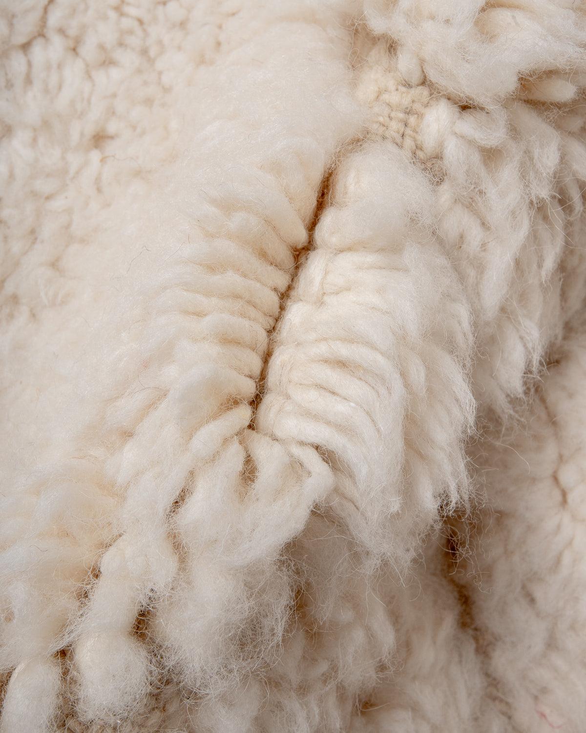 Modern, designer, handcrafted Berber rug from Morocco. Beniourain carpet with minimalist design, natural wool pile and a fluffy texture.